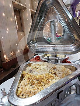 Indian or Pakistani food,mutton rice biryani on a buffet tray and oven ready for reception of a marriage partyparty.