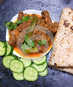 Indian Pakistani food restaurant achaar gosht spicy lamb meat cooked gravy