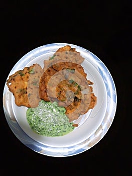 Indian pakistani snacks pakora with chatni spicy fry images