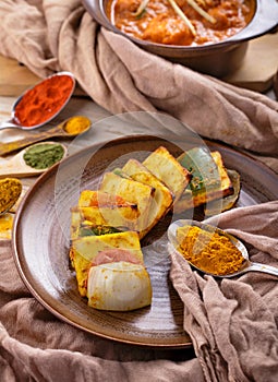 Indian paneer tikka served with chicken tikka masala