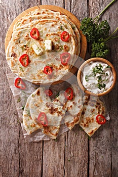 Indian paratha stuffed with potatoes. vertical top view