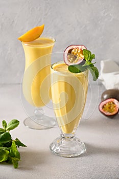Indian Passion Fruit Lassi on gray background.