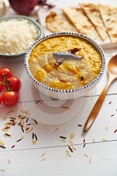 Indian popular food Dal fry or traditional Dal Tadka Curry served in bowl