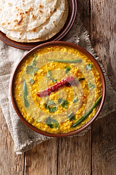 Indian popular food Dal Tadka Curry served with roti flatbread c
