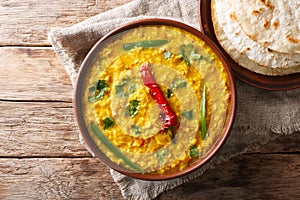 Indian popular food Dal Tadka Curry served with roti flatbread c