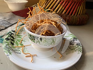 Indian popular snacks called Bhujia Sev or shev in bowl.