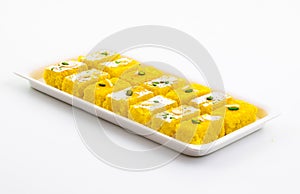 Indian Popular Sweet Food Khopara Pak or Coconut Burfi on White Background