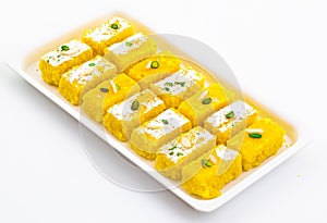 Indian Popular Sweet Food Khopara Pak or Coconut Burfi on White Background