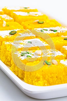 Indian Popular Sweet Food Khopara Pak or Coconut Burfi on White Background