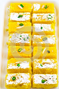 Indian Popular Sweet Food Khopara Pak or Coconut Burfi on White Background