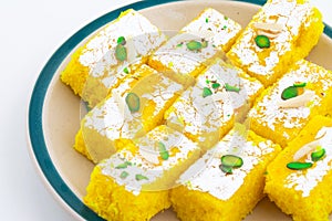 Indian Popular Sweet Food Khopara Pak or Coconut Burfi on White Background