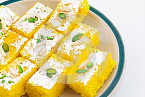 Indian Popular Sweet Food Khopara Pak or Coconut Burfi on White Background