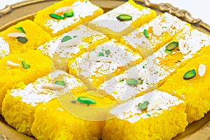 Indian Popular Sweet Food Khopara Pak or Coconut Burfi on White Background