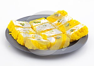 Indian Popular Sweet Food Khopara Pak or Coconut Burfi on White Background