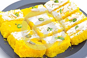 Indian Popular Sweet Food Khopara Pak or Coconut Burfi on White Background