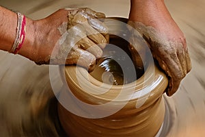 Indian potter hands at work, Shilpagram, Udaipur, Rajasthan, India