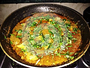 Indian punjabi style home-made matar paneer curry recipe made using cottage cheese with green peas, served in a bowl.