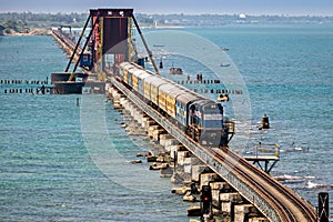 Indian Railways passenger train crossing historical , 2 kms long Pamban sea bridge photo
