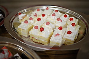 Indian reception wedding cake with roses and donuts.Beautiful wedding cake in Romantic styles