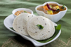 Indian Rice cake with Lentil curry. South Indian Breakfast. Idali Sambar  idli  food photo