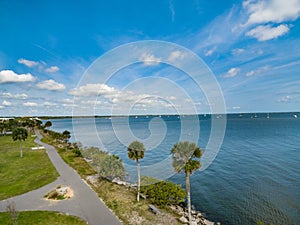 Indian River near the City of Titusville Florida on a beautiful morning with palm trees and clouds