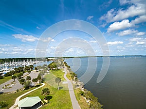 Indian River near the City of Titusville Florida on a beautiful morning with palm trees and clouds