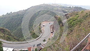 Indian road with sorounded by hill and green trees