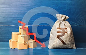 Indian rupee money bag with boxes and down arrow. Income decrease, slowdown and decline of economy. Low sales. Production decline