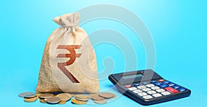 Indian rupee money bag and calculator. Accounting concept. Analysis of loan selection. Income and expenses. Calculation of damage