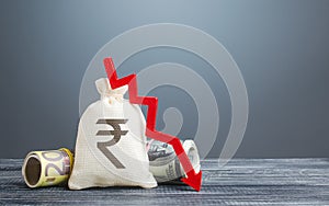 Indian rupee money bag and red arrow down. Economic difficulties. Capital flight, high risks. Costs expenses. Crisis, loss savings