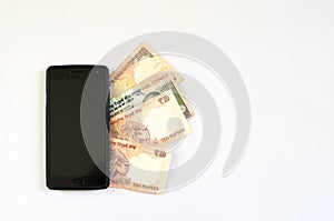 Indian rupee under a mobile