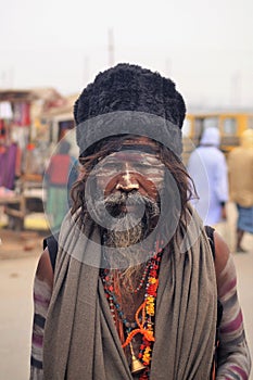 An Indian sadhu with ling hair, beard and bead necklaces.