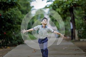 Indian School boy running at playground
