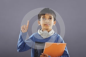 Indian School Boy with Textbook