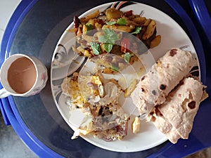 Indian self coocked breakefast with a cup of tea