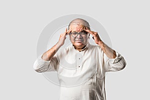 Indian senior or old man having ache or body pain, sad expressions