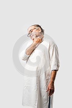 Indian senior or old man having ache or body pain, sad expressions