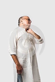 Indian senior or old man having ache or body pain, sad expressions