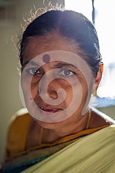Indian senior woman with warm backlight