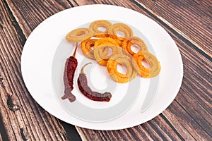 Indian Snack Chakli, a spiral crisp fried snack, It is known as Chakali, Murukku, Muruku, Murkoo, Chakri in Gujarat, Chakli in