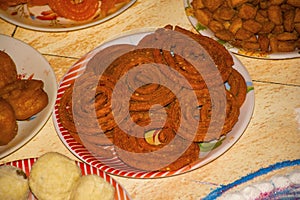 Indian snack - chakli. Spiral shaped, pretzel-like snack with a spiked surface