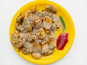 INDIAN SNACK DISH PAKODE WITH SAUCE AND CHILI BREAKFAST CUISINE