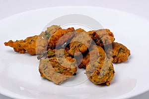 Indian snack pakora with tomato sauce or chutney