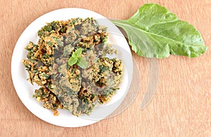Indian Snack Palak Pakoda and Spinach Leaf photo