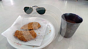 Indian snack tea and black aviators