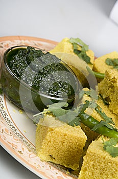 Indian Snacks Dhokla with green chutney