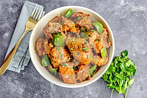 Indian Spiced Chicken Curry Garnished with Green Bell pepper and Cilantro