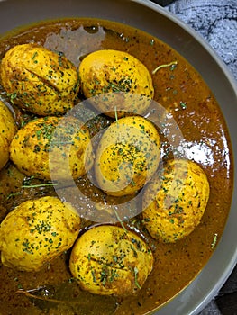 An Indian spread of spicy Egg curry or Egg Masala in a bowl