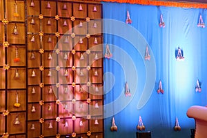 indian stage decoration with flowers and bells