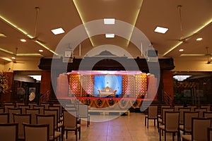 indian stage decoration with flowers and bells